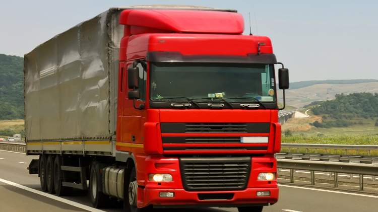Road freight transportation to/from Moldova, showcasing vehicles loaded with cargo for delivery.