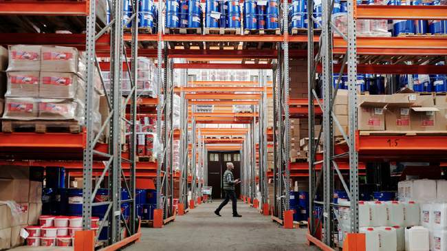 Warehouse with organized shelves showcasing Yes2Ship’s Amazon FBA, export packing, and fulfillment services.